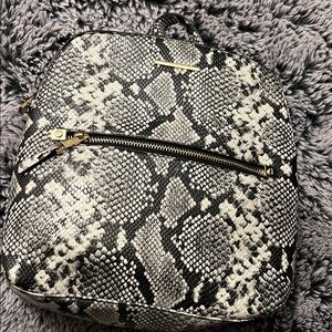 Aldo Black and Cream Snakeskin Backpack